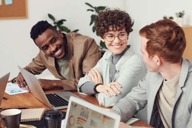 Three employees happy at work