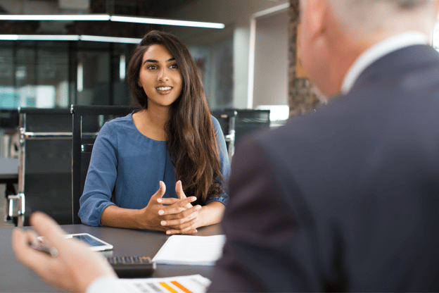 A Human Resources Manager interviewing a person for a job.