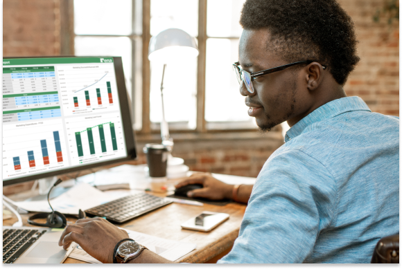 Finance pro working on a report at his desktop