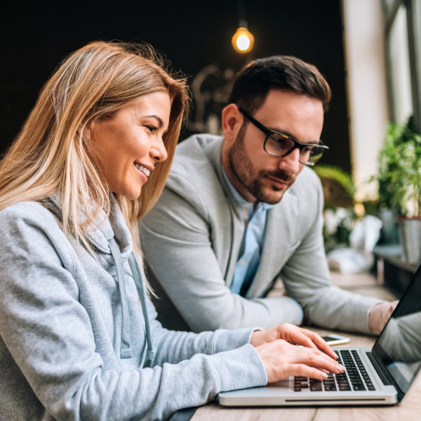 business-people-man-and-woman-having-a-meeting-in-a-cafe_square