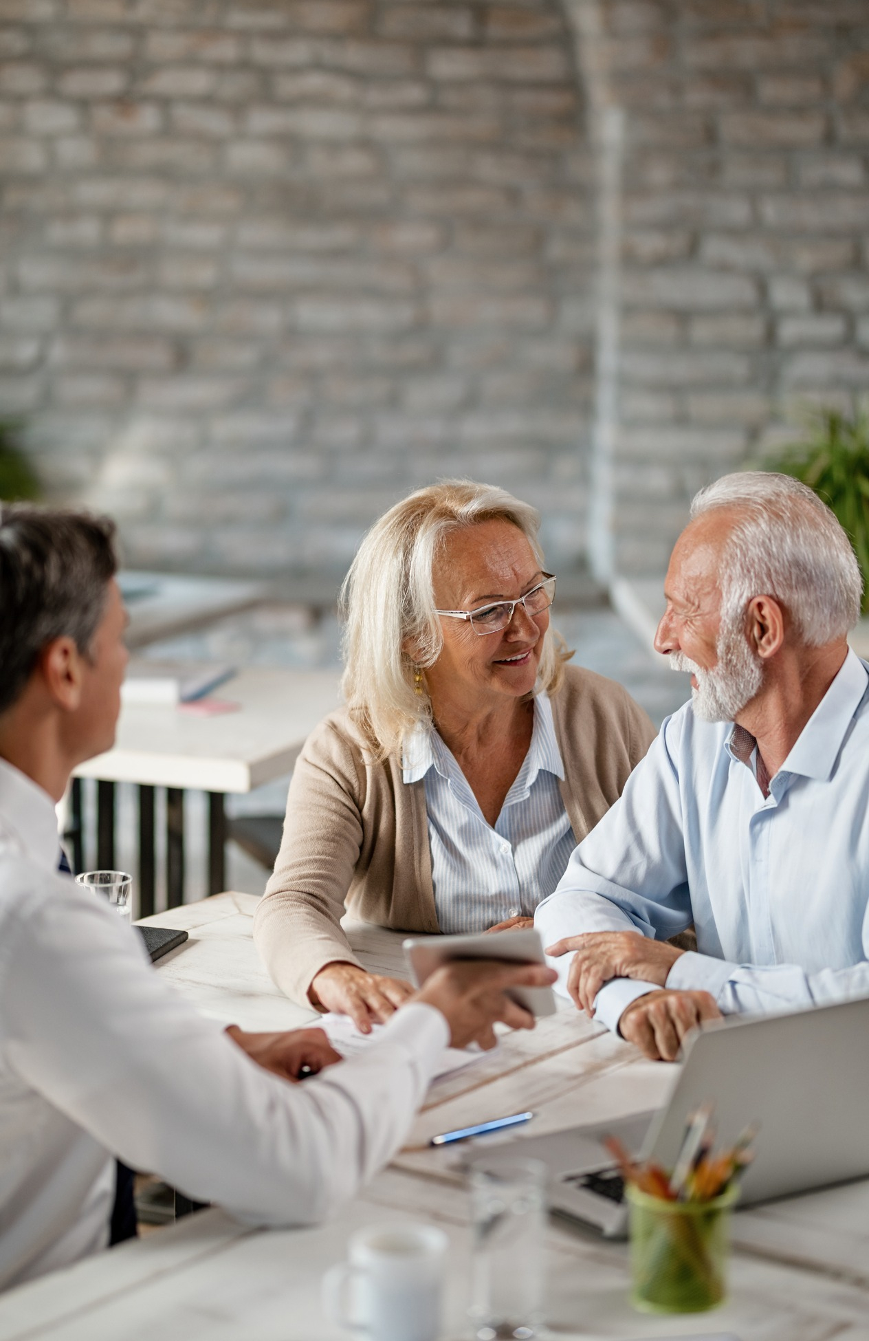 Three people sitting and talking