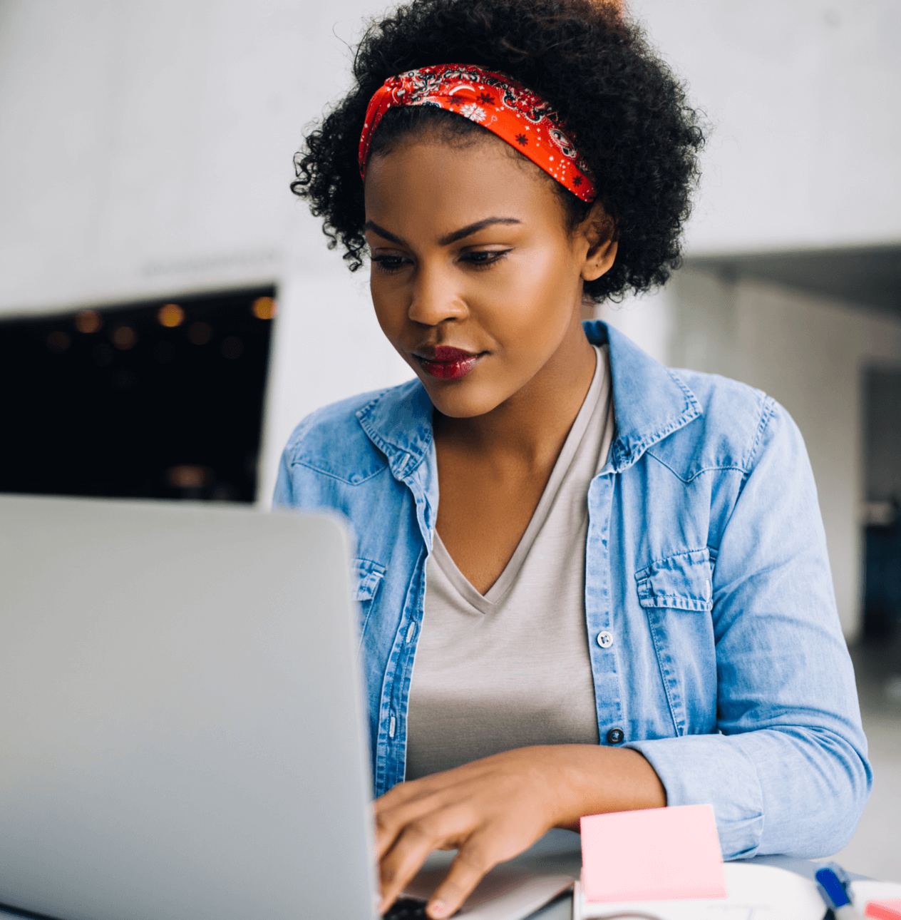 African American woman working on her laptop.