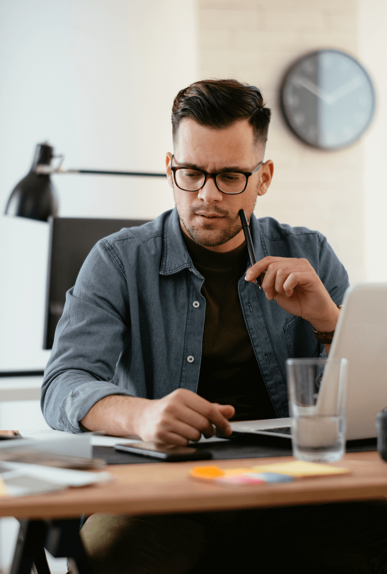 Stressed Caucasian man working at his desk.