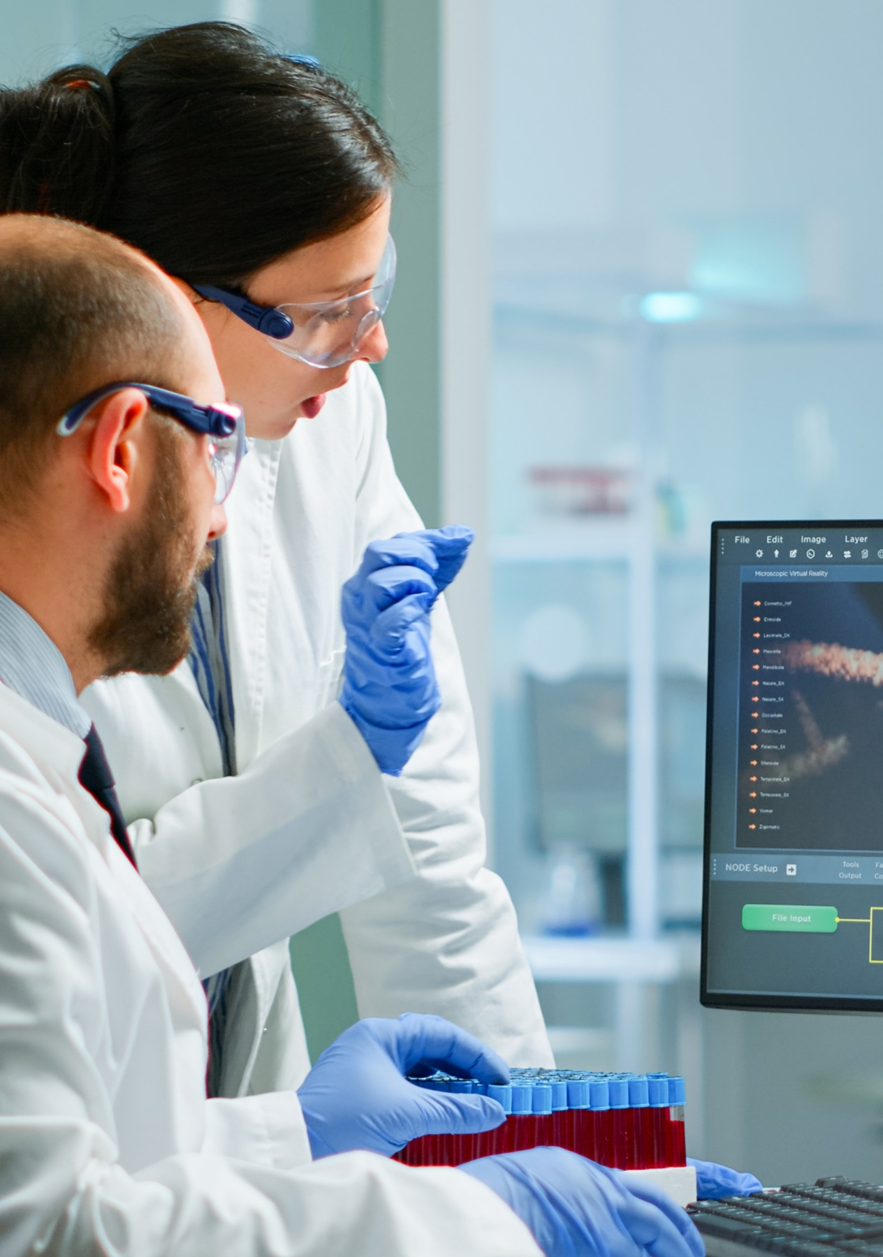 Two people wearing lab coats