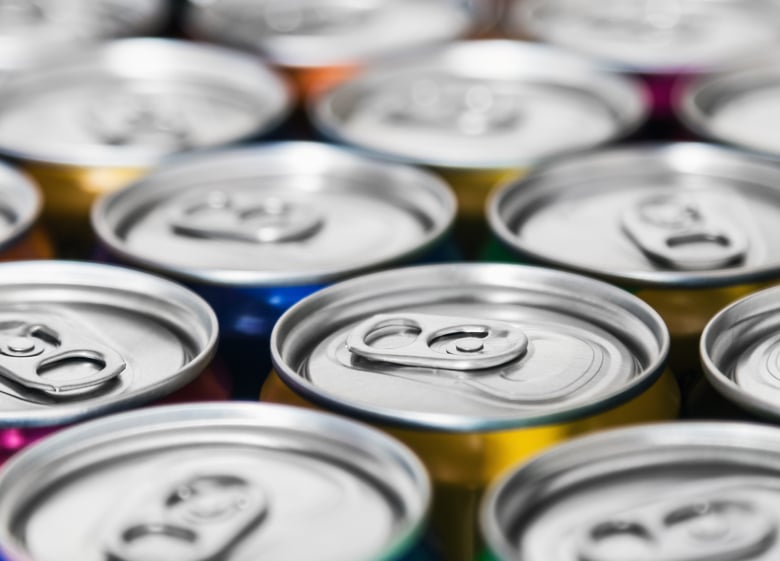 Image of the tops of several soda cans