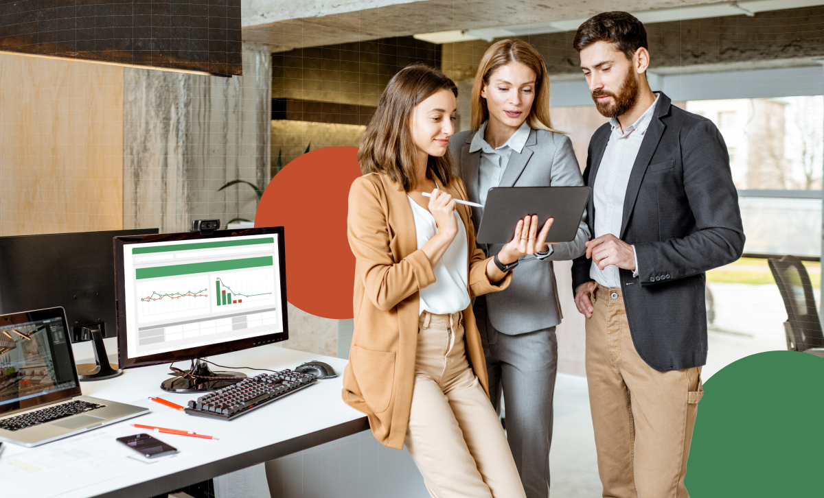 Business professional holding a tablet looking up analytics using FP&A automation software