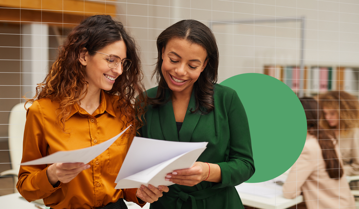 Two women reading a report together