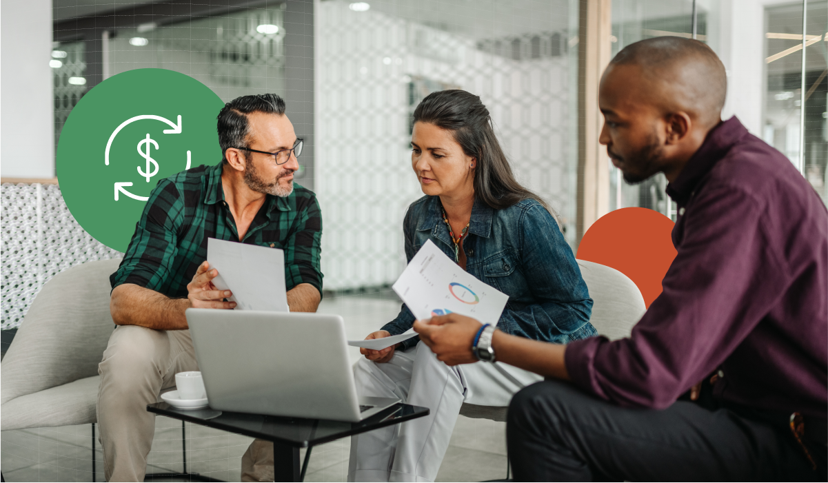 Three coworkers looking at a cash flow report