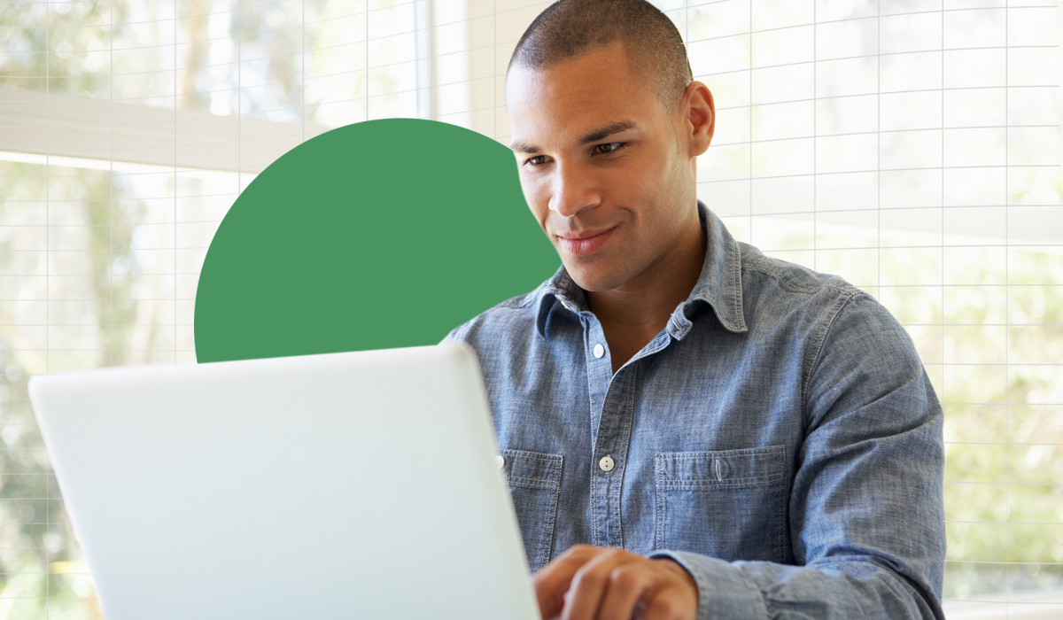 A person looking at a laptop screen