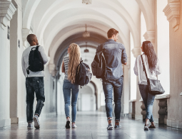 Image of students walking down a school hallway