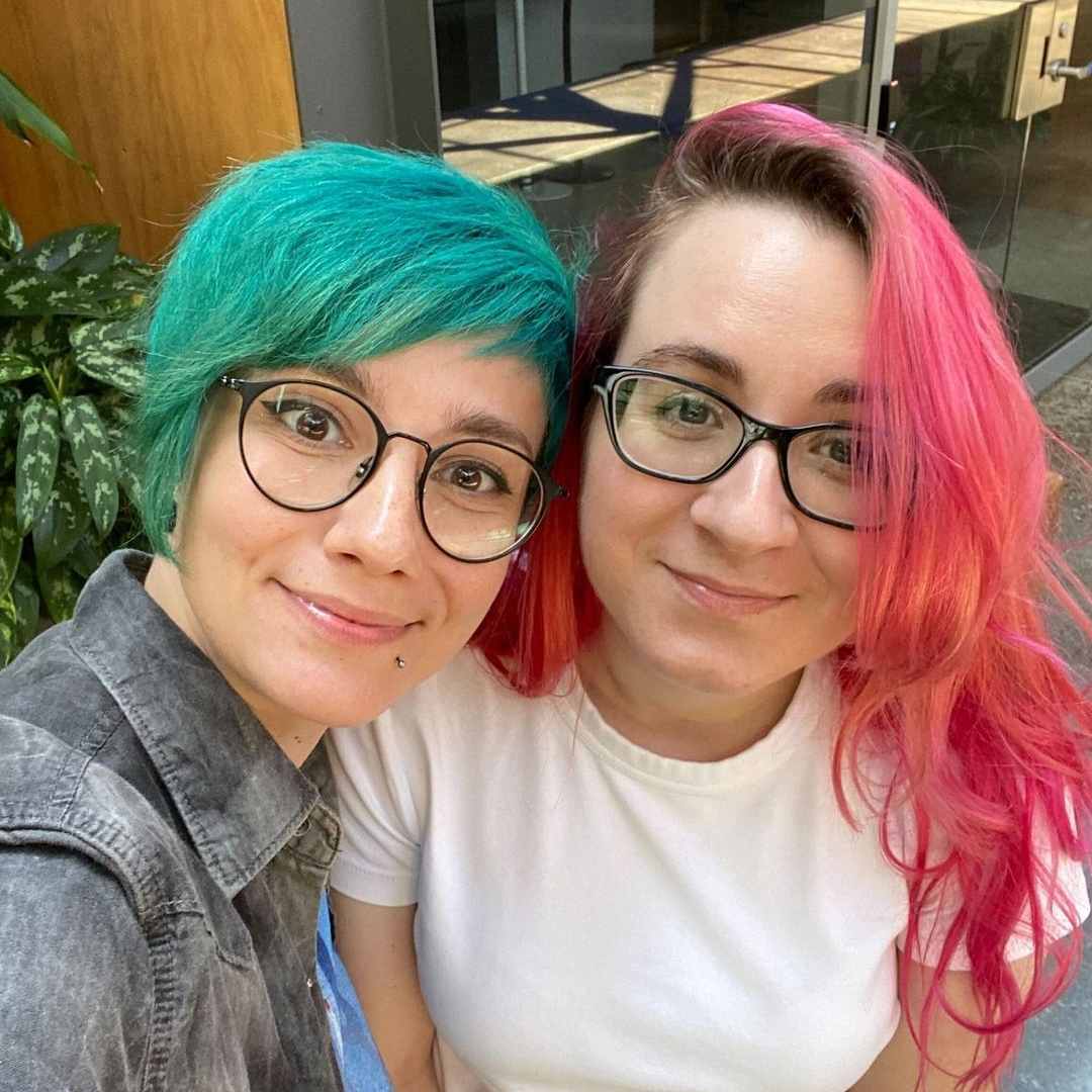 Photo of two Vena team members with colourful hair